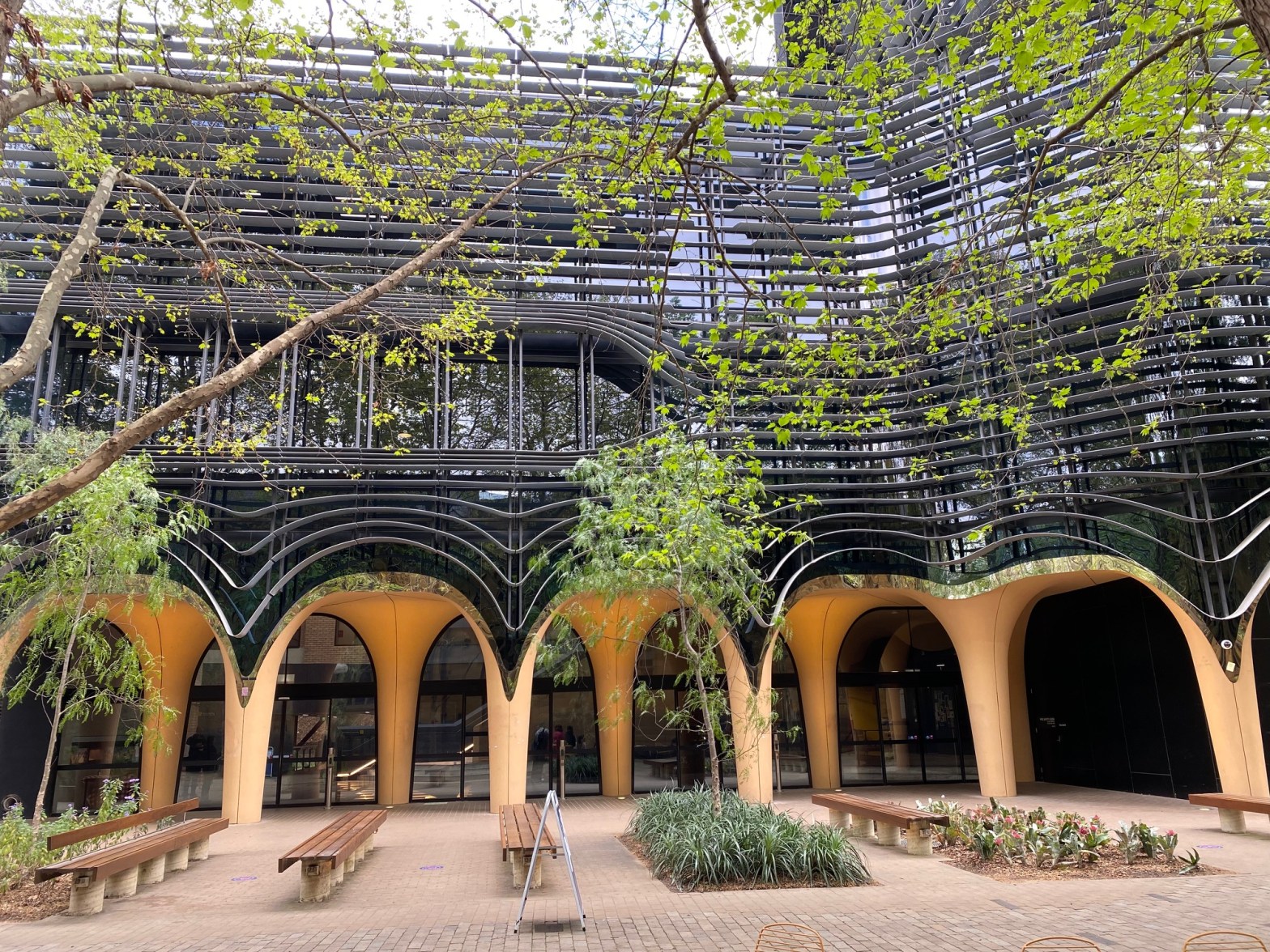 The arched entryway to the Arts West building at the University of Melbourne