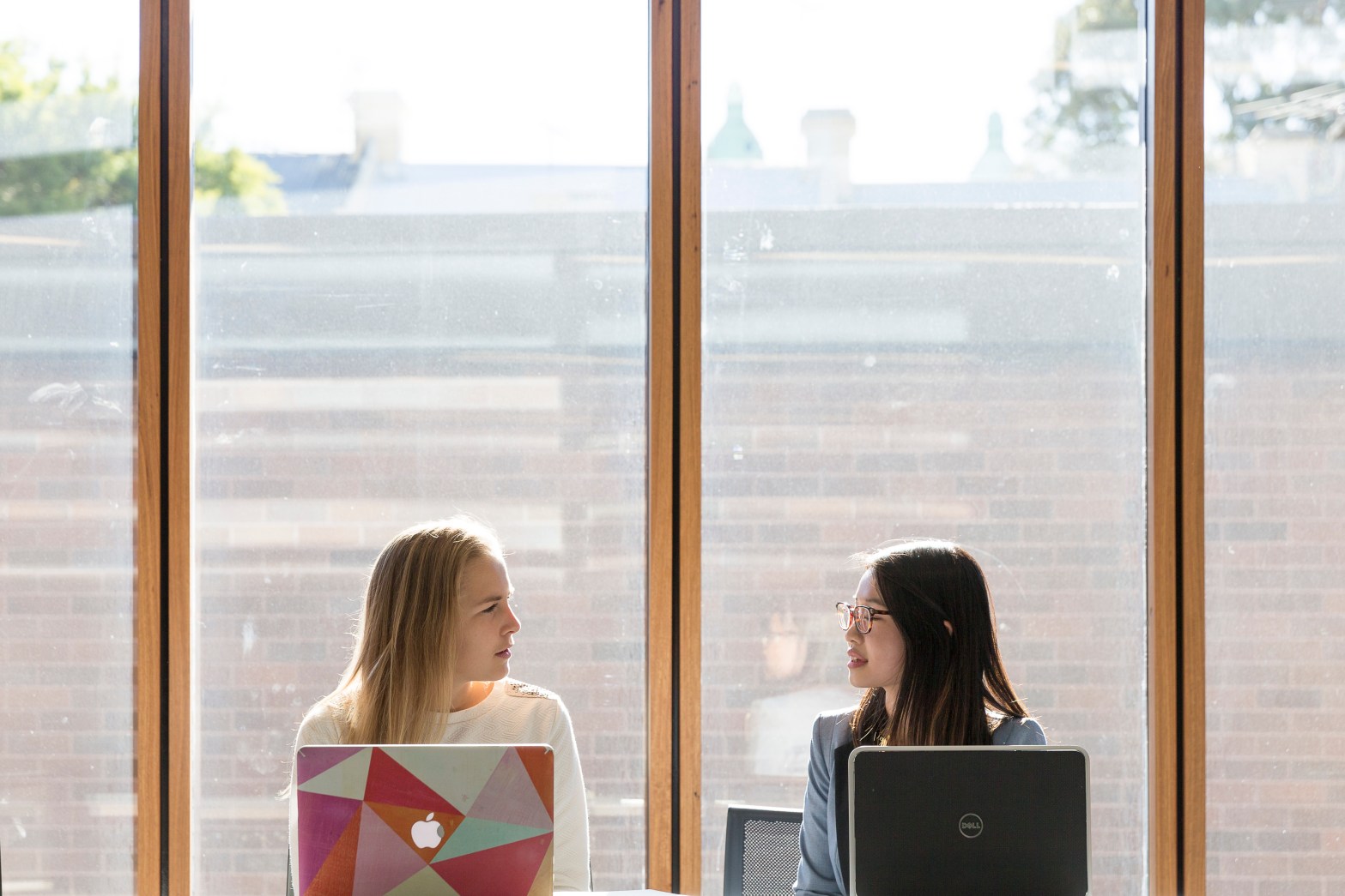 Students chatting at the Business School Abercrombie building. Students at lecture, representing the idea of overcoming social Isolation